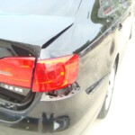 Before and after photographs of a damaged black Volkswagon Jetta that was repaired by Elite Paint & Body Shop in West Palm Beach, Florida.